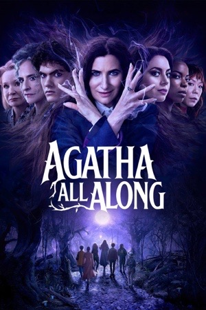 Kathryn Hahn with hands raised in purple light, other witches ranged around her.