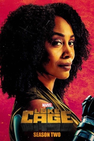 Simone Missick in front of a red background, Luke Cage behind her in shadow.